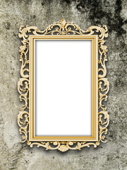 Close-up of one blank golden Baroque picture frame on brown weathered concrete wall background