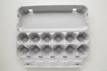 Fotobehang Empty carton of dozen eggs package © SewcreamStudio