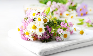 Bouquet of meadow flowers on napkin