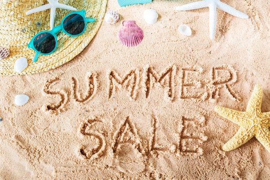 Summer Sale text in the sand
