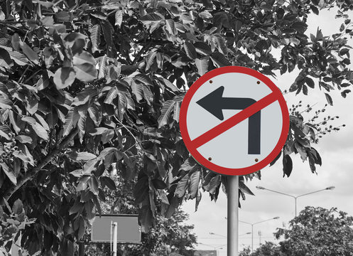 Traffic sign, no turn left on black and white background.