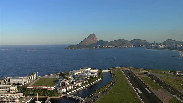 Flying above the airport with Sugar Loaf Mountain view, Rio de Janeiro, Brazil.