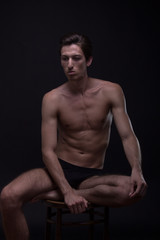 Fototapeta na wymiar Nude young man Caucasian skinny, slim, fit abs