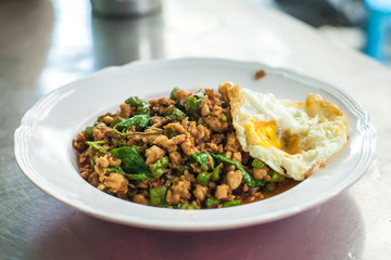 stir fried pork whit basil and fried egg Thai food