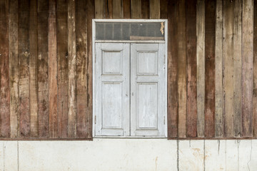 Windows on old wooden wall