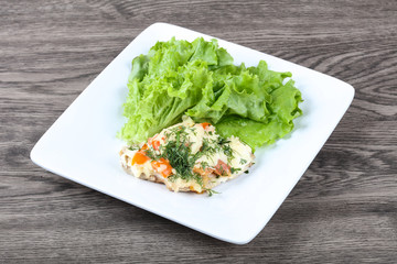 Meat covered cheese and tomato