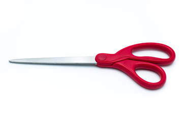 Red scissors on white