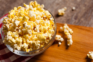 A bowl of popcorn on tablecloth