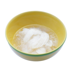 sweet in thai - woon ma praw orn - young coconut jelly in yellow bowl isolated on white background