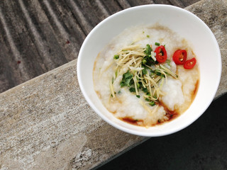asian food - a bowl of congee with minced pork on grunge background

keyword