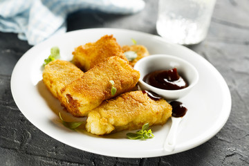 Fried fish stripes with bbq sauce