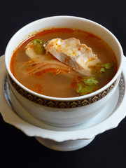 thai food - tom yum pla - spicy soup with fish and lemongrass