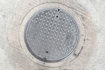 Rusty, grunge manhole cover