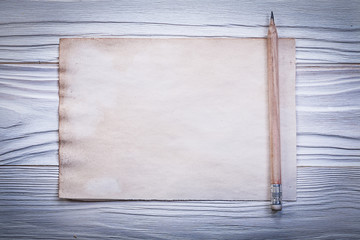 Vintage paper sheet for menu pencil on wooden board horizontal v