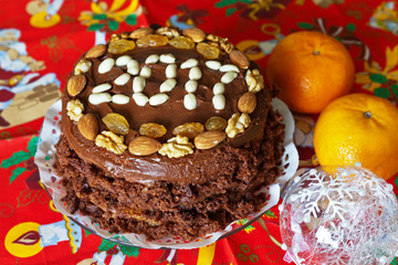 Preparing for the New Year 2017. Homemade cake on festive tablecloth