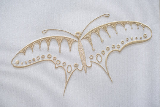 Embroidery butterfly on cotton background