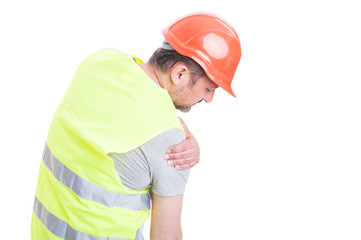 Young builder feeling tension in right shoulder