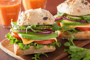tomato avocado cheese sandwich with cucumber onion