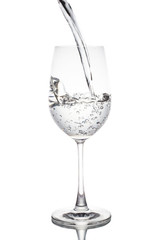 Water poured in a glass transparent white background