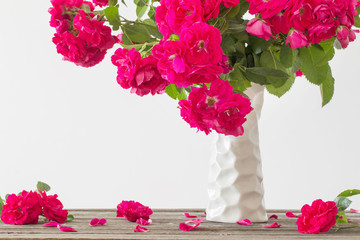 still life of red rose in ceramic vase