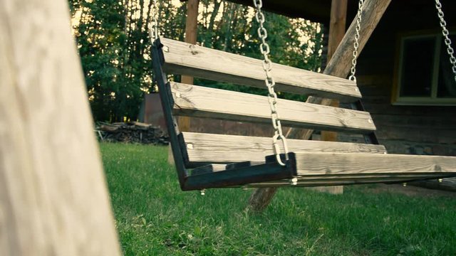 Old swing in the yard with light effect. weirdness