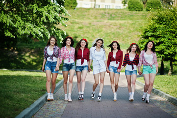 Seven happy and sexy girls on short shorts posed and having fun