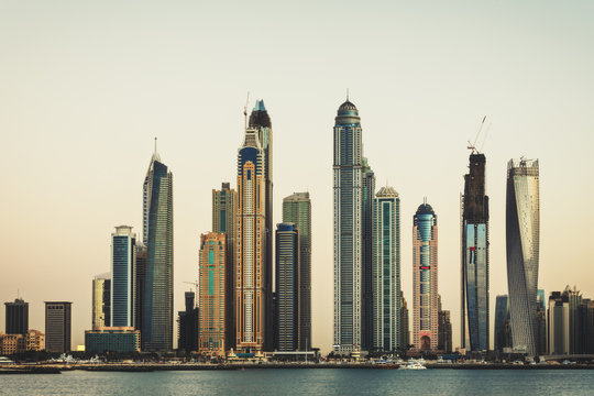 Dubai Marina skyline at sunset. View over the famous towers.