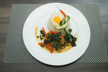 Rice topped with stir-fried pork and basil