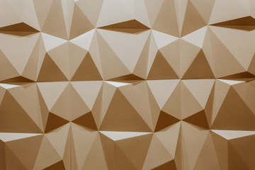 abstract wallpaper or geometrical background consisting of warm or orange geometric shapes: triangles and polygons