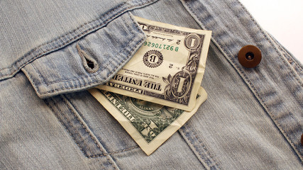 American dollar bills in jeans pocket background. Dollars in a