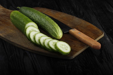 cucumbers on wooden background