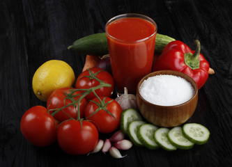 vegetables and tomato juice on wooden background