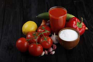vegetables and tomato juice on wooden background