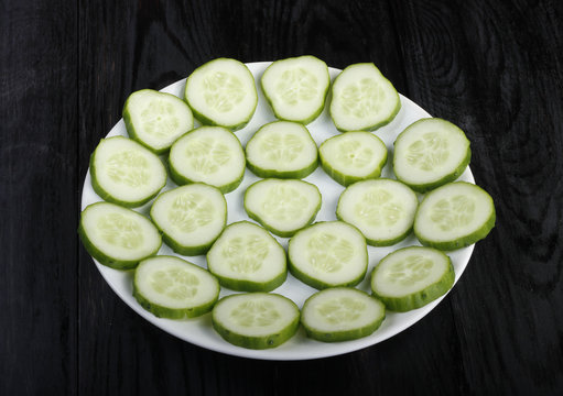 cucumbers on wooden background