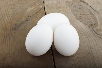 white eggs on wooden background