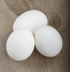 white eggs on wooden background