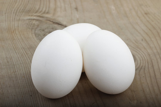 white eggs on wooden background