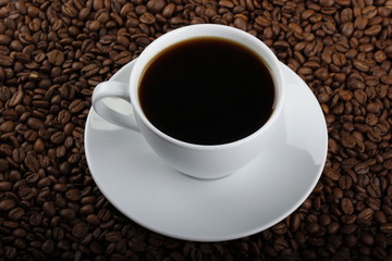 cup of coffee on wooden background