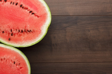 watermelon pieces on the brown wooden table