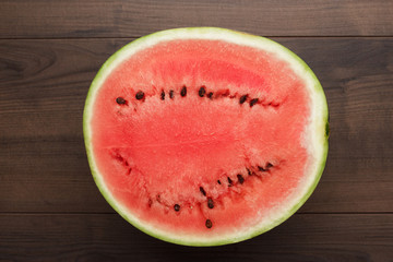 Fototapeta na wymiar half of watermelon on the wooden table