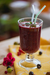 Fragrant refreshing berry smoothie in glass wine glasses