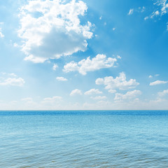 Obraz premium blue sea and clouds over it