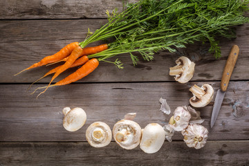 Ingredients for cooking: mushrooms, carrots and garlic