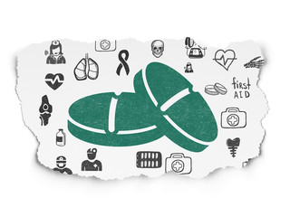 Health concept: Pills on Torn Paper background