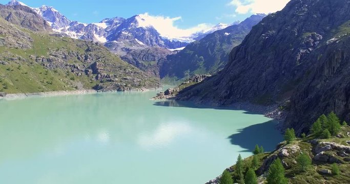 Aerial 4k - Valmalenco (IT) - Sorvolo della diga di Alpe Gera verso nord