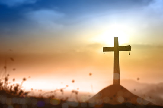 Ascension day concept: Cross on sunset background