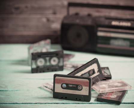 old cassette tape and player on the wood background