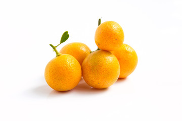 Orange Kumquat placed on whte background