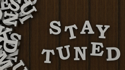 Word, stay tuned made with block wooden letters. 3d render