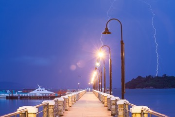 Lightning bolt strike into sea with natural lens flare